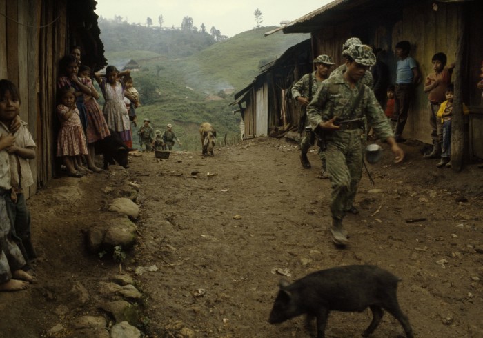 Guatemalan soldiers occupy La Perla coffee plantation in Chajul, Quiché (1982) as Indigenous villagers watch.